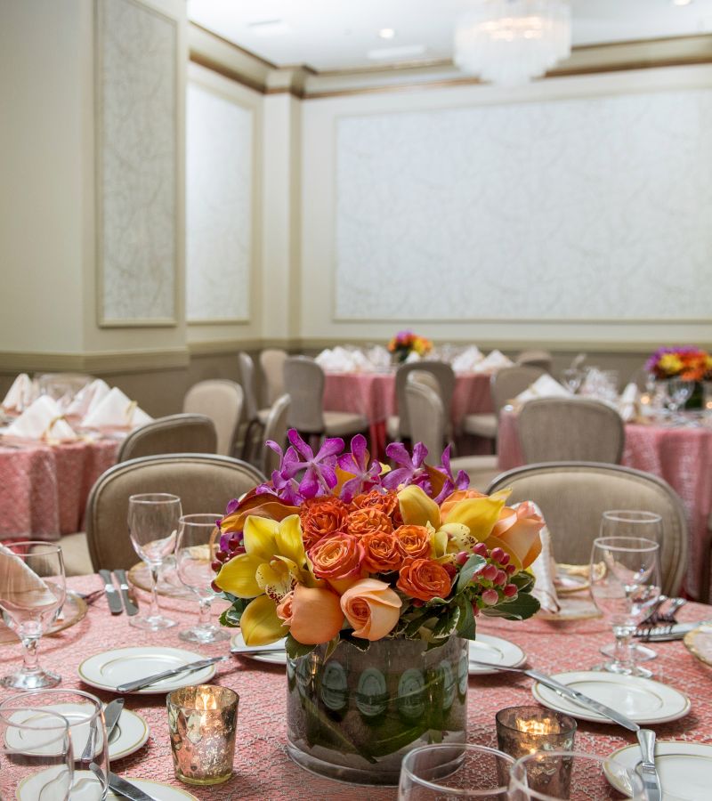 a dining room with tables set for a meal