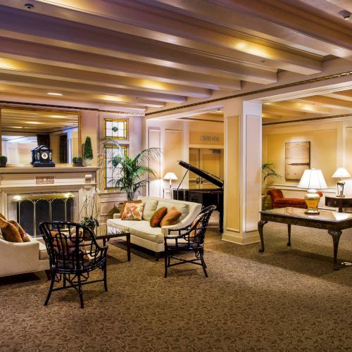 A stylish, well-lit dining area with multiple tables, warm wooden accents, and modern decor. Top it at 140 characters, always ending the sentence.